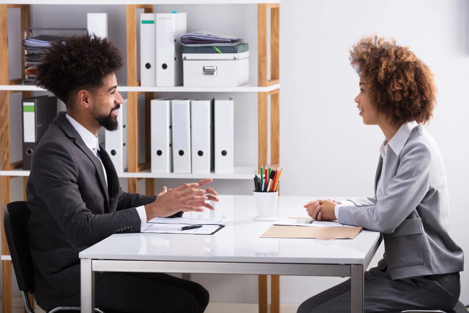 Student practising visa interview answers with a coach in a mock interview session