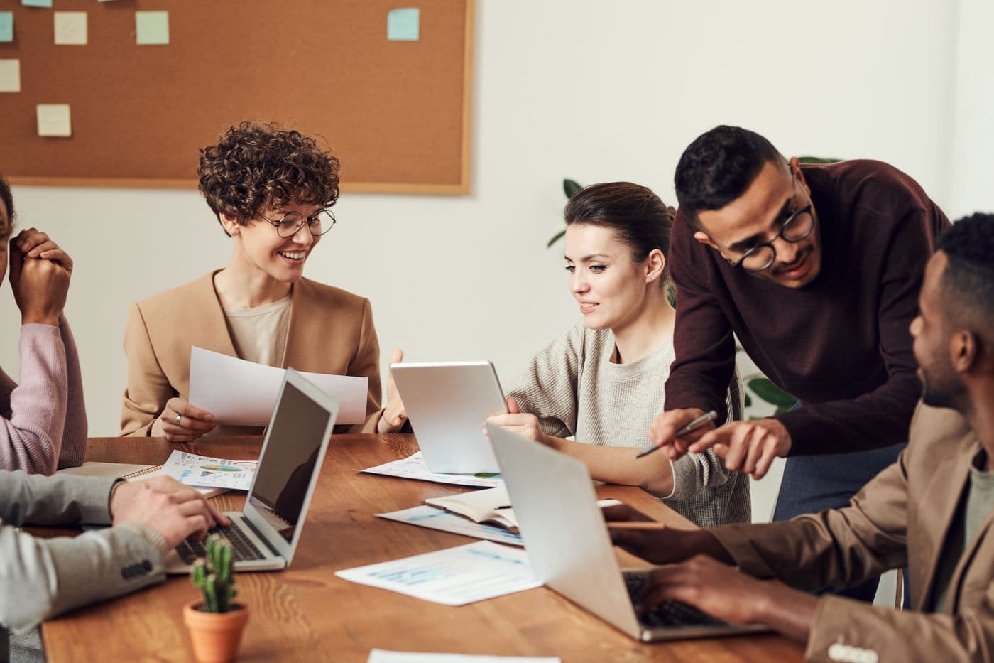 Professionals discussing documents together around a table